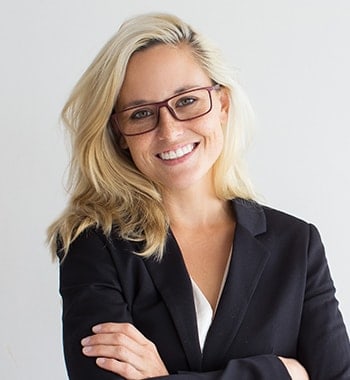 woman wearing glasses in a suit