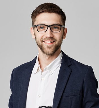 Man with glasses dressed business casual